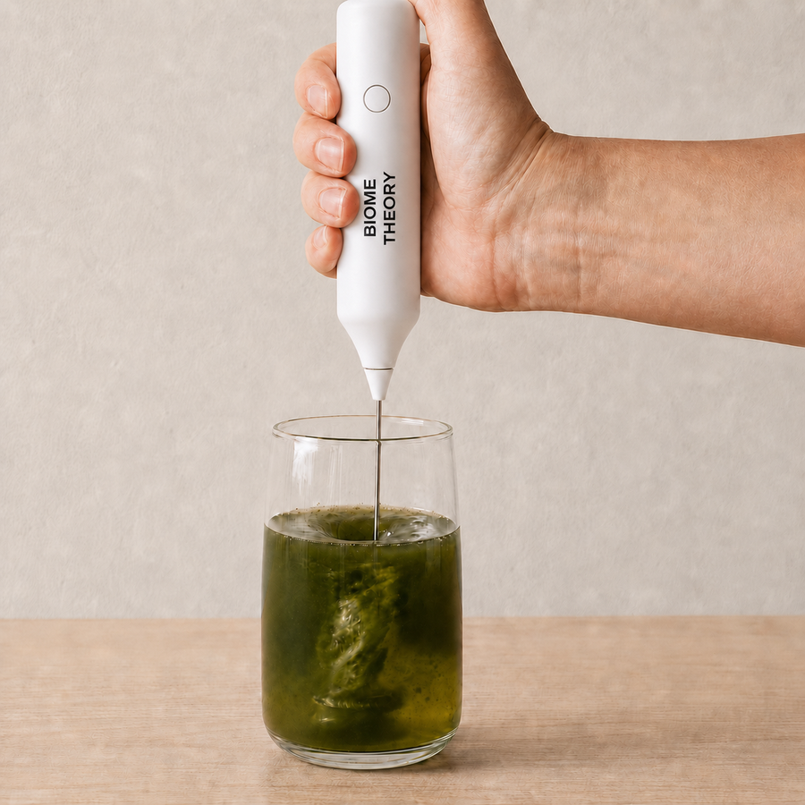 A Biome Theory mixer blending the green drink in a glass
