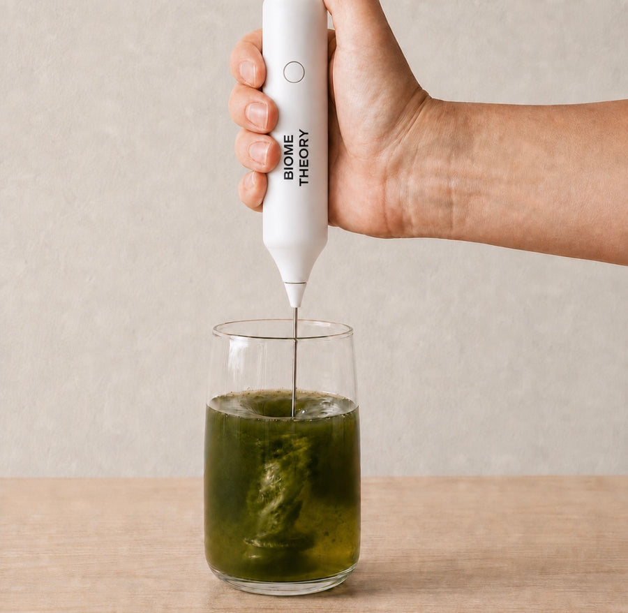 A Biome Theory mixer blending the green drink in a glass