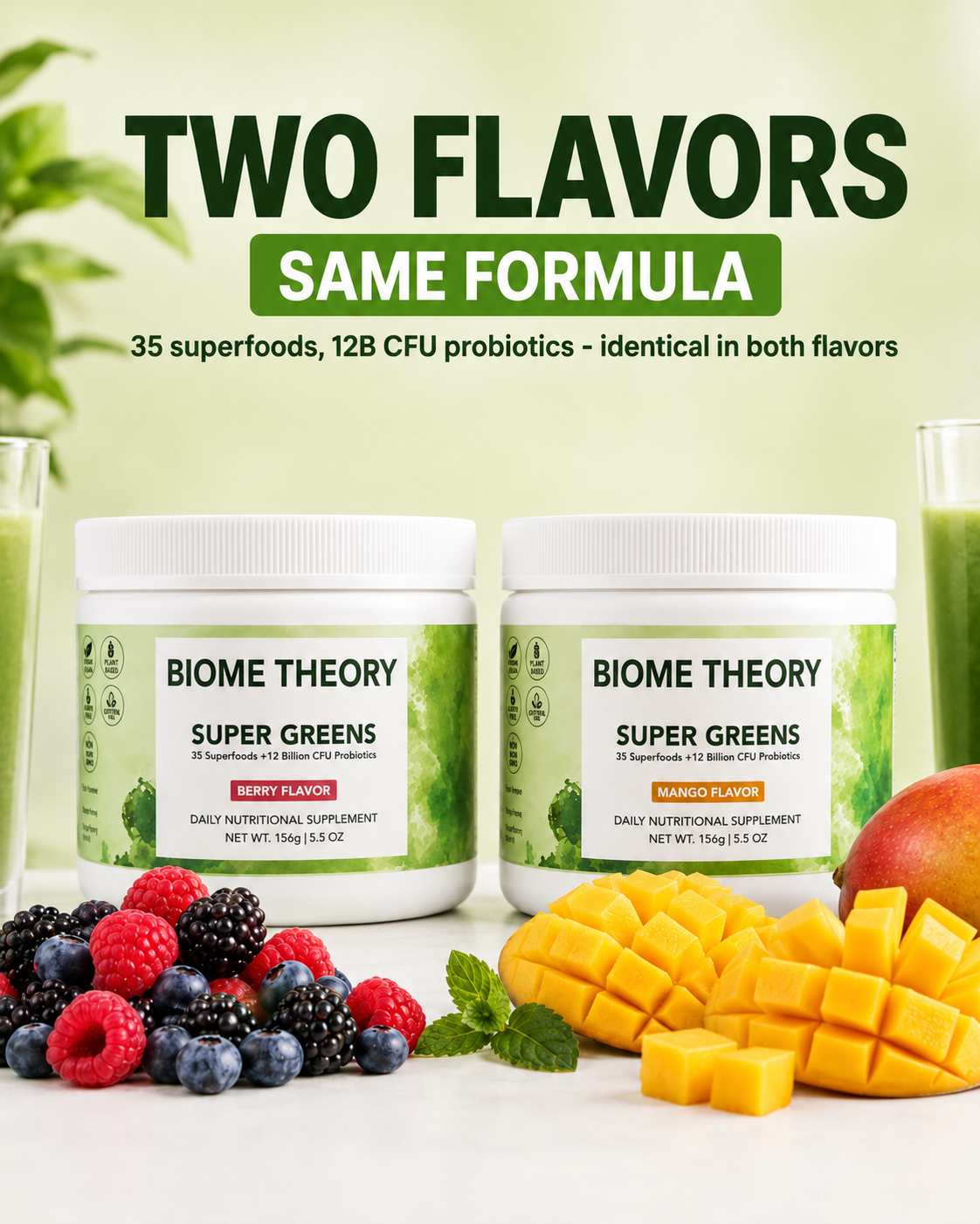 Two white jars of BIOME THEORY Super Greens probiotics dietary supplement displayed side by side on a white surface with green juice glasses, fresh berries, blackberries, and mango slices. Large text at the top reads 'TWO FLAVORS SAME FORMULA'.